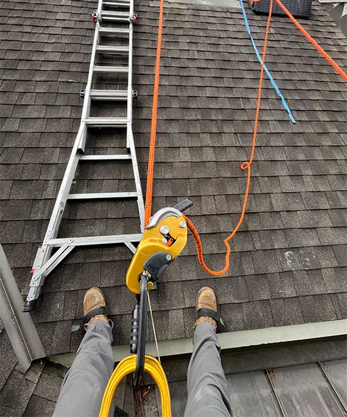 Technician working on Chimney Technician working on Chimney